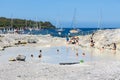 People relaxing in healthy mud pool at Aeolian Islands, Italy