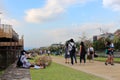 People relaxing in Kamo river. Its riverbanks are popular walking spots for residents and tourists.