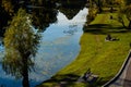 People relaxing near the lake in Nicolae Romanescu Park, Craiova, Romania