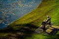 People relaxing near the lake in Nicolae Romanescu Park, Craiova, Romania Royalty Free Stock Photo