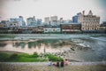 People are relaxing nearby river in Kyoto