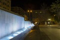 People relaxing and night view of a decorative fountain