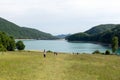 People relaxing on the Paltinu lake shore