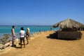 People are relaxing on Red Sea beach. Vacation, resort, holidays, leisure, travel. Picturesque Royalty Free Stock Photo