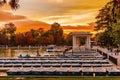 People relaxing in rowboats in the scenic pond of Buen Retiro Pa