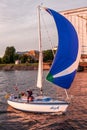 People waving from a sailboat in Riga, Latvia