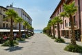 People relaxing in the small restaurant in historic town square in Sirmione, Italy