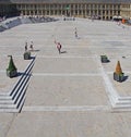 People relaxing on the steps and cafes and walking across the square of halifax piece hall in west yorkshire