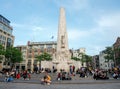 People relaxing on the steps of the National Monument, Amsterdam Royalty Free Stock Photo