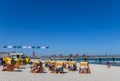 People relaxing in traditional beach chairs in Binz