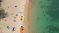 People relaxing on tropical beach on Phuket island in Thailand.