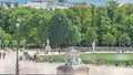 People relaxing in Tuileries Palace open air park near Louvre museum timelapse. Paris, France Royalty Free Stock Photo
