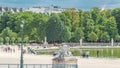 People relaxing in Tuileries Palace open air park near Louvre museum timelapse. Paris, France Royalty Free Stock Photo