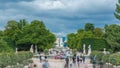 People relaxing in Tuileries Palace open air park near Louvre museum timelapse. Paris, France Royalty Free Stock Photo