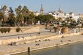 People relaxing at waterfront in Sevilla