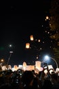 People releasing paper lanterns during Loi Krathong and Yi Peng festival Royalty Free Stock Photo