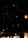 People releasing paper lanterns during Loi Krathong and Yi Peng festival Royalty Free Stock Photo