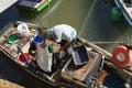 People removing goods from the boats docked on the deck of the SÃÂ£o Joaquim fair, in Salvador, on a sunny day