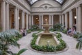 people rest in the atrium of the Frick Collection, former 5th Avenue mansion of steel magnate Henry Clay Frick