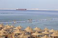 People rest on the beach near red sea in resort hotel, Sharm El Sheikh, Egypt Royalty Free Stock Photo