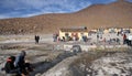 People rest at the geothermal hot water spring