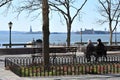 People rest in park at Manhattan waterfront