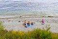 People rest on a rocky beach, top view Royalty Free Stock Photo