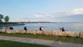 People rest on the shores of Lake Ontario