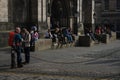 People resting at the entrance of St. Giles Cathedral, Edinburgh, Scotland