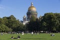 People resting on the grass in Alexander Garden park on sunny summer day