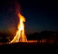 People resting near big bonfire outdoor Royalty Free Stock Photo