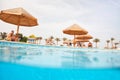 People resting near swimming pool