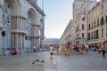 People are resting on the Piazza San Marco and sightseeing in Venice, Italy