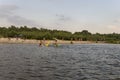 People resting and sailing. Summer beach on one of the banks of river Desna. Oster, Ukraine. Juny 17, 2017