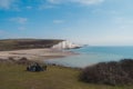 People resting at Seaford Head Nature Reserve and the Cuckmere Haven peacefull seafront beach at the top of the Chalk Cliffs walk