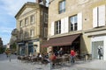 People resting in a street restaurant