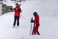 People Returning after a Day of Skiing taking off their Skis