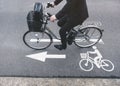 People ride bicycle on Road Bike lane Signage Royalty Free Stock Photo