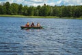 People ride on a boat speedboat rest travel on water on the background of the beautiful nature of the lake of the river of the sea Royalty Free Stock Photo