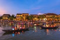 People ride boats and release lanterns at Thu Bon River