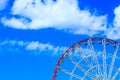 People ride a ferris wheel in the city park Royalty Free Stock Photo