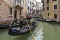 People ride gondolas along the canals of Venice Royalty Free Stock Photo