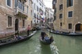 People ride gondolas along the canals of Venice Royalty Free Stock Photo