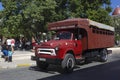 People ride truck buses (camion) in Holguin.