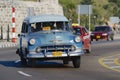 People ride in a vintage taxi car in Havana, Cuba. Royalty Free Stock Photo