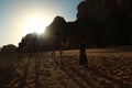 People rides on camels in Wadi Rum desert in Jordan Royalty Free Stock Photo