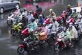 People rides on the motorcycle during rainy day in Bangkok