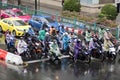 People rides on the motorcycle during rainy day in Bangkok