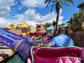 People riding the Aladdin Magic Carpet ride at Disney World