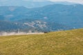 people riding on all terrain vehicle by mountains Royalty Free Stock Photo